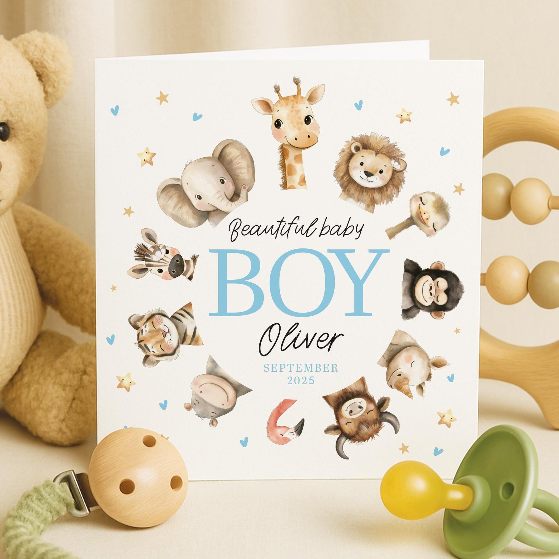 Personalised newborn baby boy congratulations card with safari jungle animals and custom name.