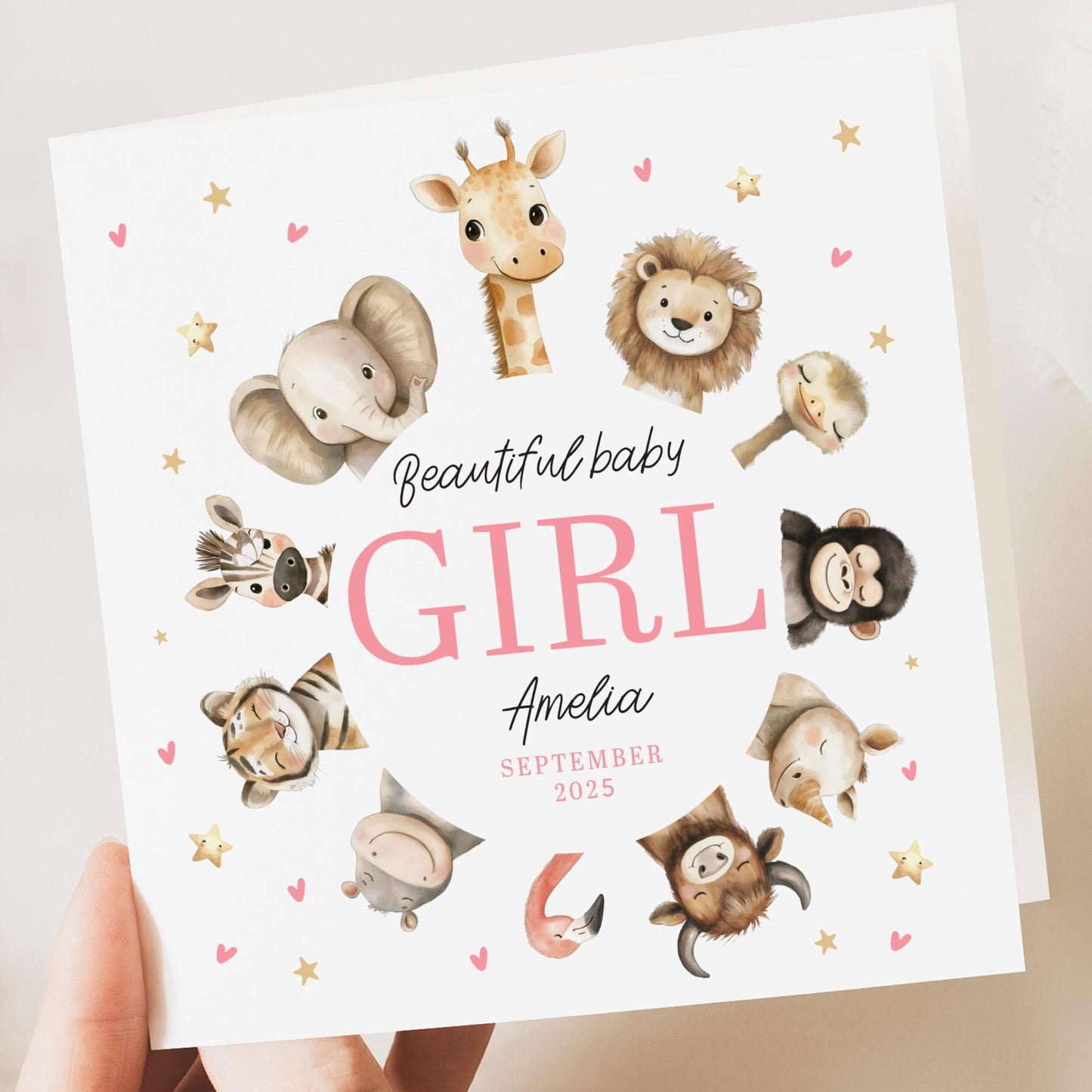 Personalised newborn baby girl congratulations card with safari jungle animals and custom name.